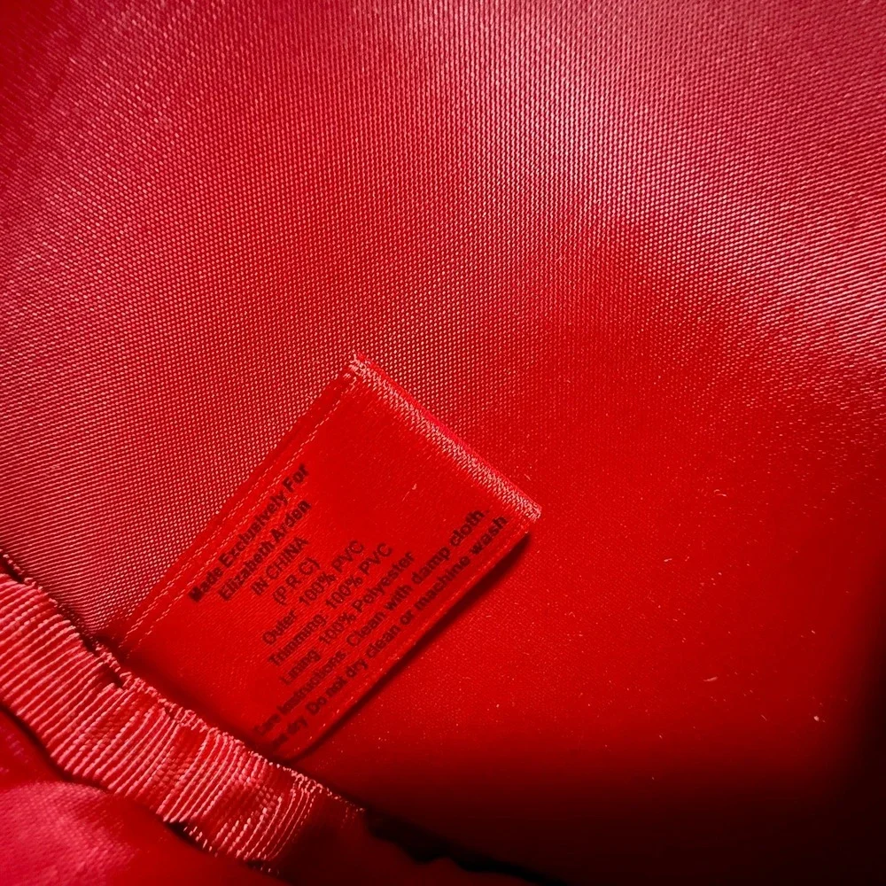 Elizabeth Arden Red Round Makeup Case World Color Faux Leather Pom Pom Bag